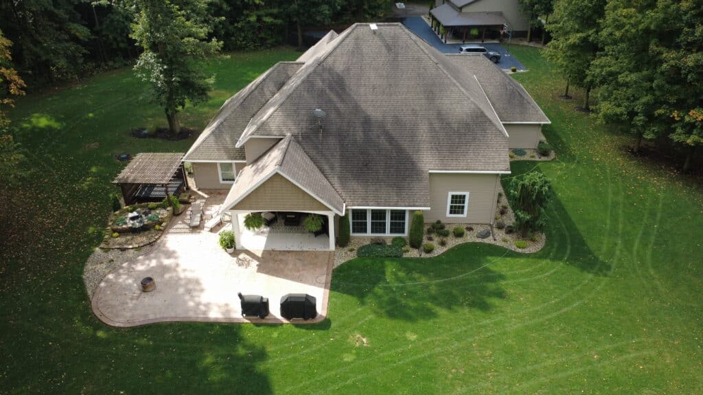 Dirty asphalt roof before soft wash roof cleaning service completed in Fort Wayne Indiana