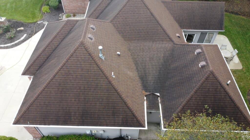 Before results of professional roof cleaning removing black streaks from shingles in inverness lakes Fort Wayne Indiana